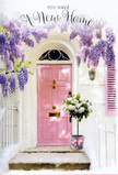 This photograph feels like a love letter to new beginnings in Spitalfields, set against the backdrop of a pastel-painted doorway. At the centre stands a pink front door in a muted, comforting shade, its smooth panels catching the soft light that might drift down the narrow streets between Brick Lane and the old Huguenot houses nearby. The surrounding wall is white and slightly textured, giving the impression of an older building freshly cared for, while a single blush shutter repeats the door's hue and adds a balanced, symmetrical calm to the composition. From above, wisteria pours down in loose, luxuriant cascades, each trailing stem laden with clusters of lavender blossoms. The flowers form a gentle arch around the entrance, their imagined scent sweet and enveloping, a floral curtain that blurs the line between inside and outside. Resting on the top step, right at the threshold, is a modest grey metal bucket that has been turned into a showcase for a florist's craft. It overflows with white and cream roses, their petals thick, soft, and layered in elegant spirals. Some roses are wide open, revealing their hearts; others remain in tighter buds, hinting at beauty still to unfold. Sprigs of fresh greenery weave between the blooms, adding contrast, texture, and a sense of freshness. Around the bucket, a pink ribbon is tied in a loose, satin bow, the ends trailing softly over the stone like a finishing touch on a thoughtfully wrapped gift. The overall mood is gentle, hopeful, and embracing-a perfect visual for a housewarming or congratulations arrangement, as if a local Spitalfields florist has left this bouquet by the door to quietly say, welcome home.